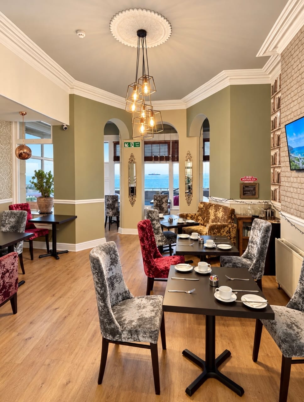 Breakfast room at Atlanta Guest House overlooking the seafront